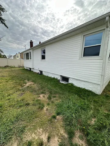 a kitchen with kitchen island a counter top space cabinets and stainless steel appliances
