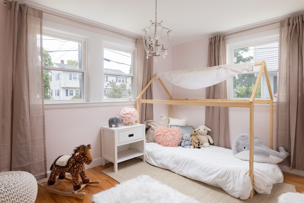 15 Wheaton Road Arlington, MA 02474 - Photo 11 of 19 a bedroom with a bed and a window