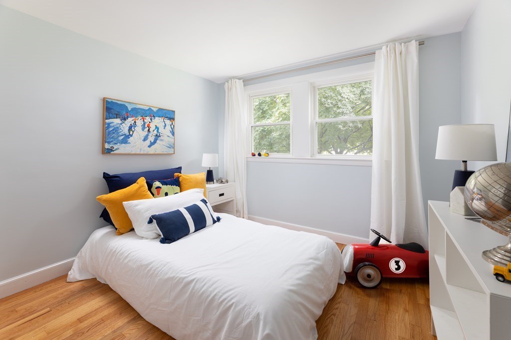 15 Wheaton Road Arlington, MA 02474 - Photo 14 of 19 a bedroom with a bed and wooden floor
