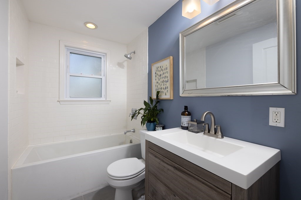 15 Wheaton Road Arlington, MA 02474 - Photo 15 of 19 a bathroom with a sink toilet and a mirror