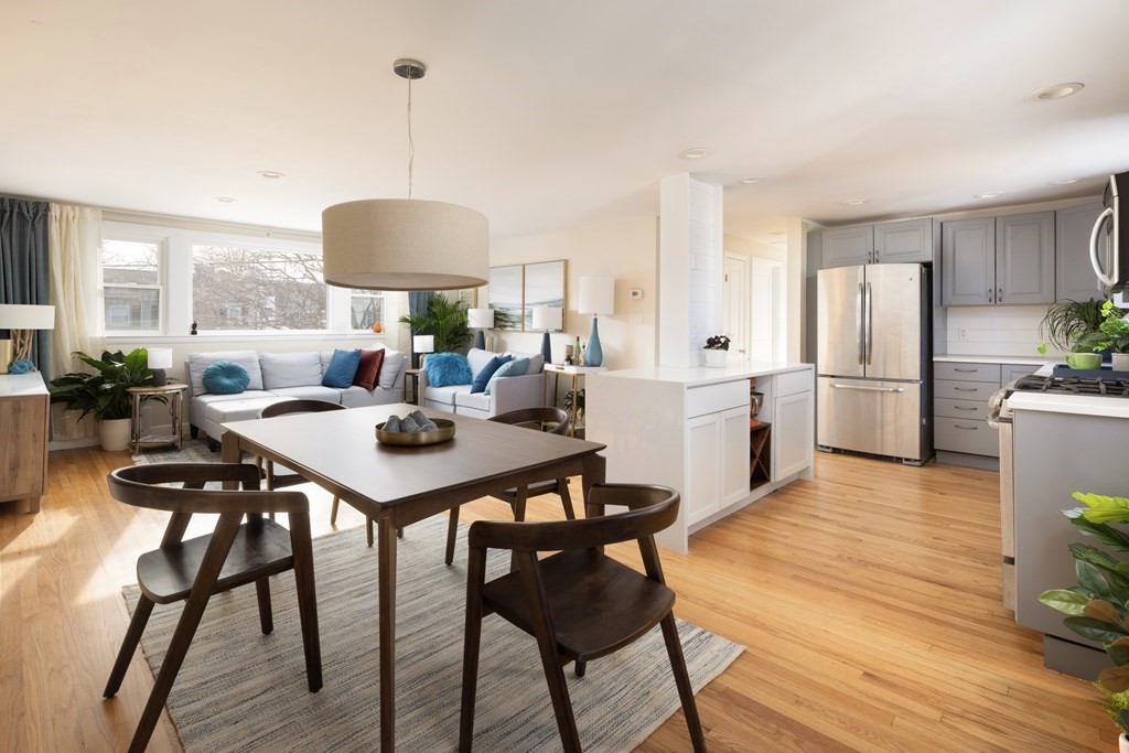 15 Wheaton Road Arlington, MA 02474 - Photo 7 of 19 a view of a dining room with furniture a chandelier and wooden floor