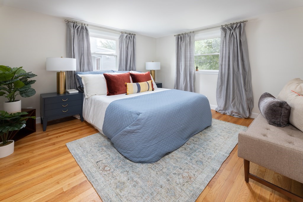 15 Wheaton Road Arlington, MA 02474 - Photo 10 of 19 a bedroom with a large bed and a window