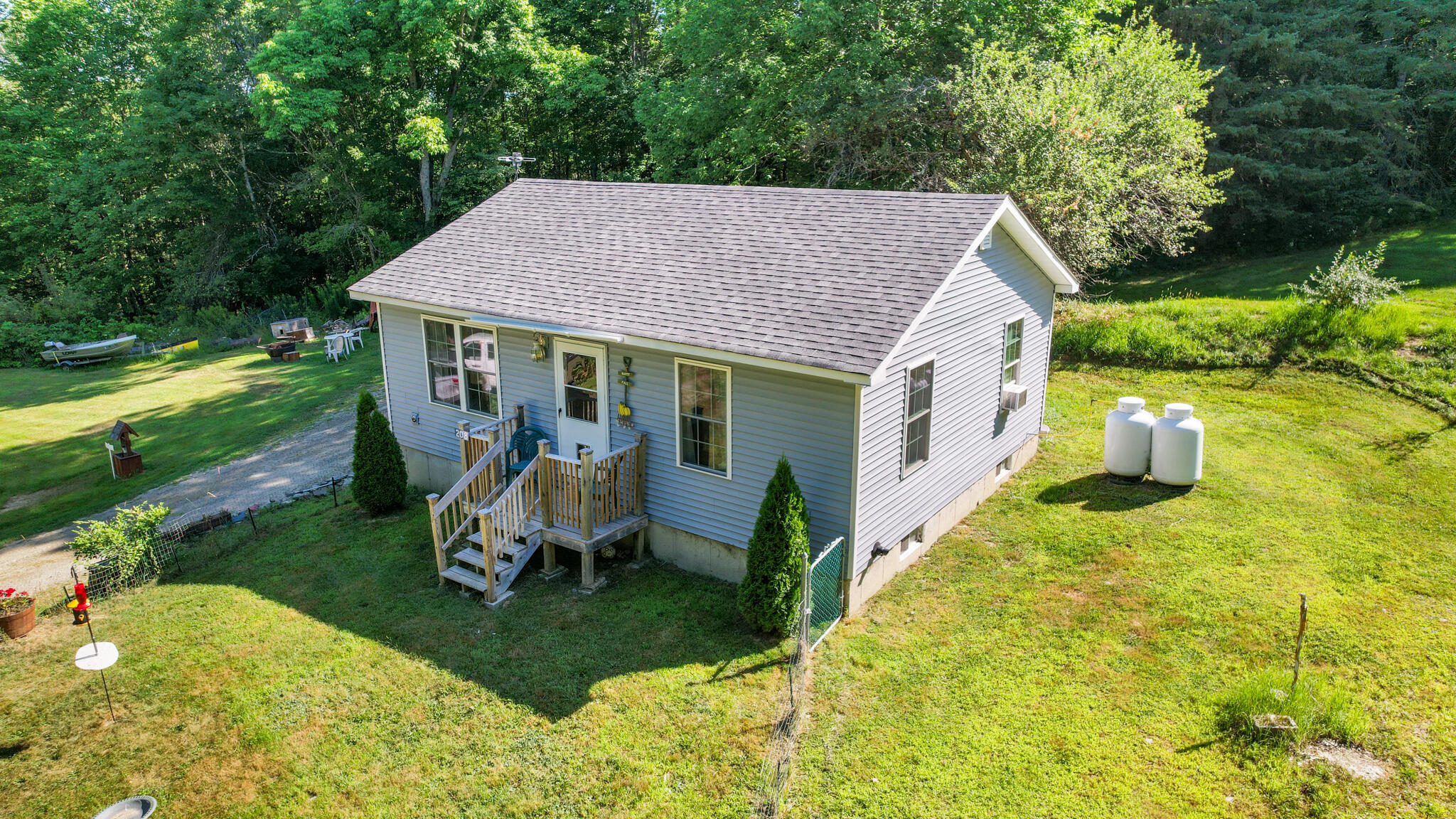 208 Upper Dedham Road Dedham, ME 04429 - Photo 3 of 56 Sideview of house and yard
