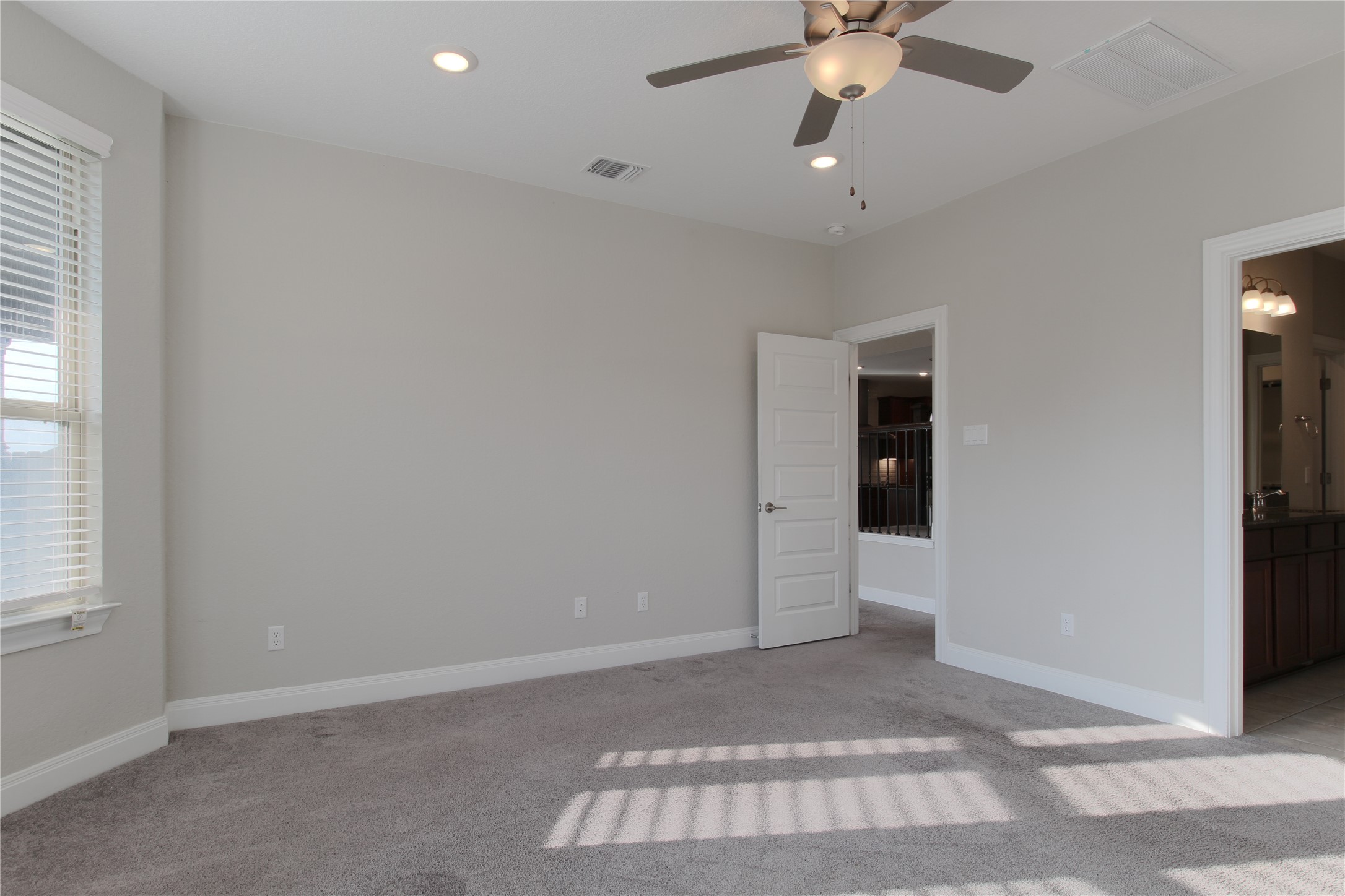 109 Yellow Thistle Cove Georgetown, TX 78626 - Photo 17 of 36 Carpeted room featuring a ceiling fan with integrated lighting, recessed lighting, base molding, window with blinds, and a five-panel interior door