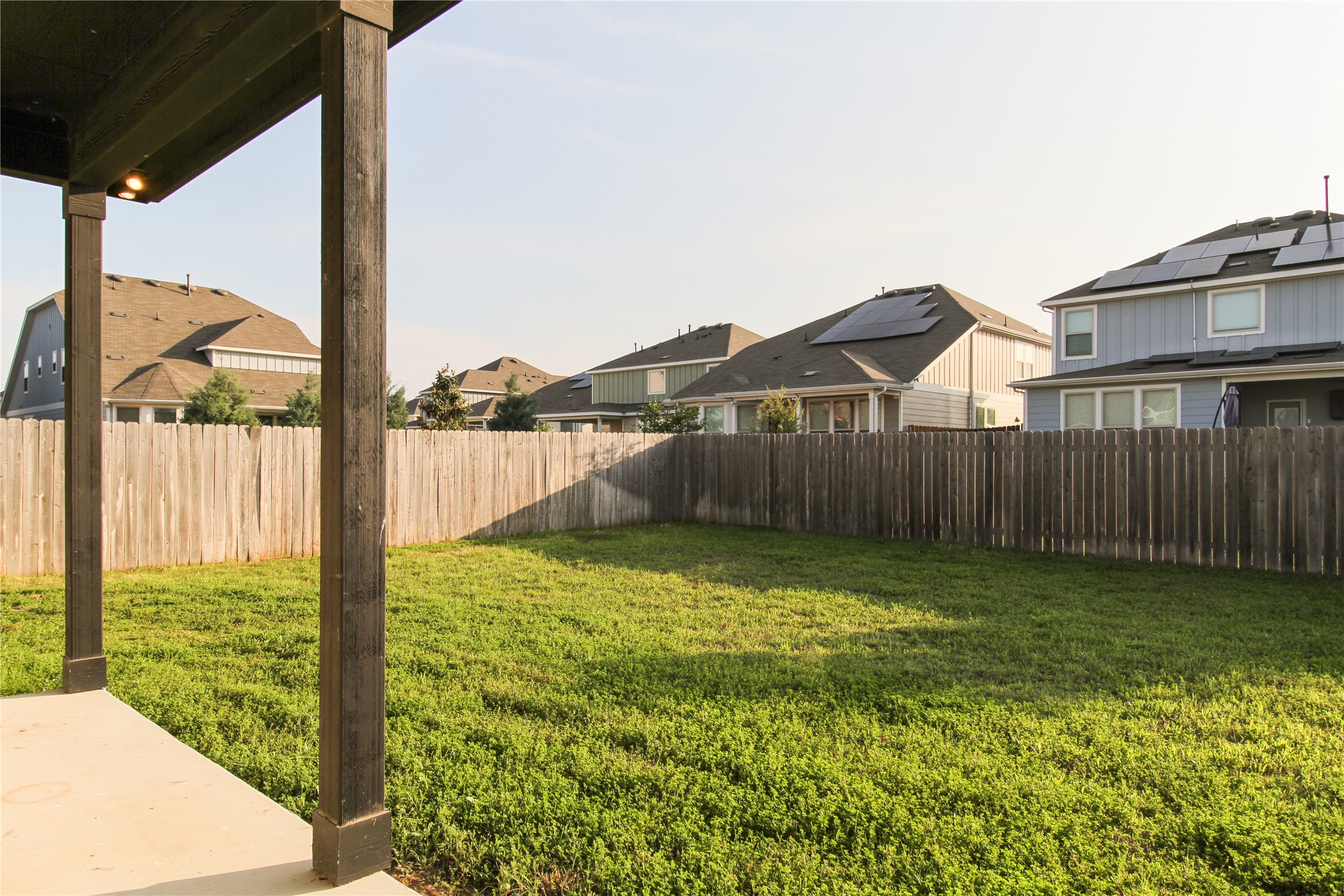 109 Yellow Thistle Cove Georgetown, TX 78626 - Photo 31 of 36 Covered patio area opening to a green lawn