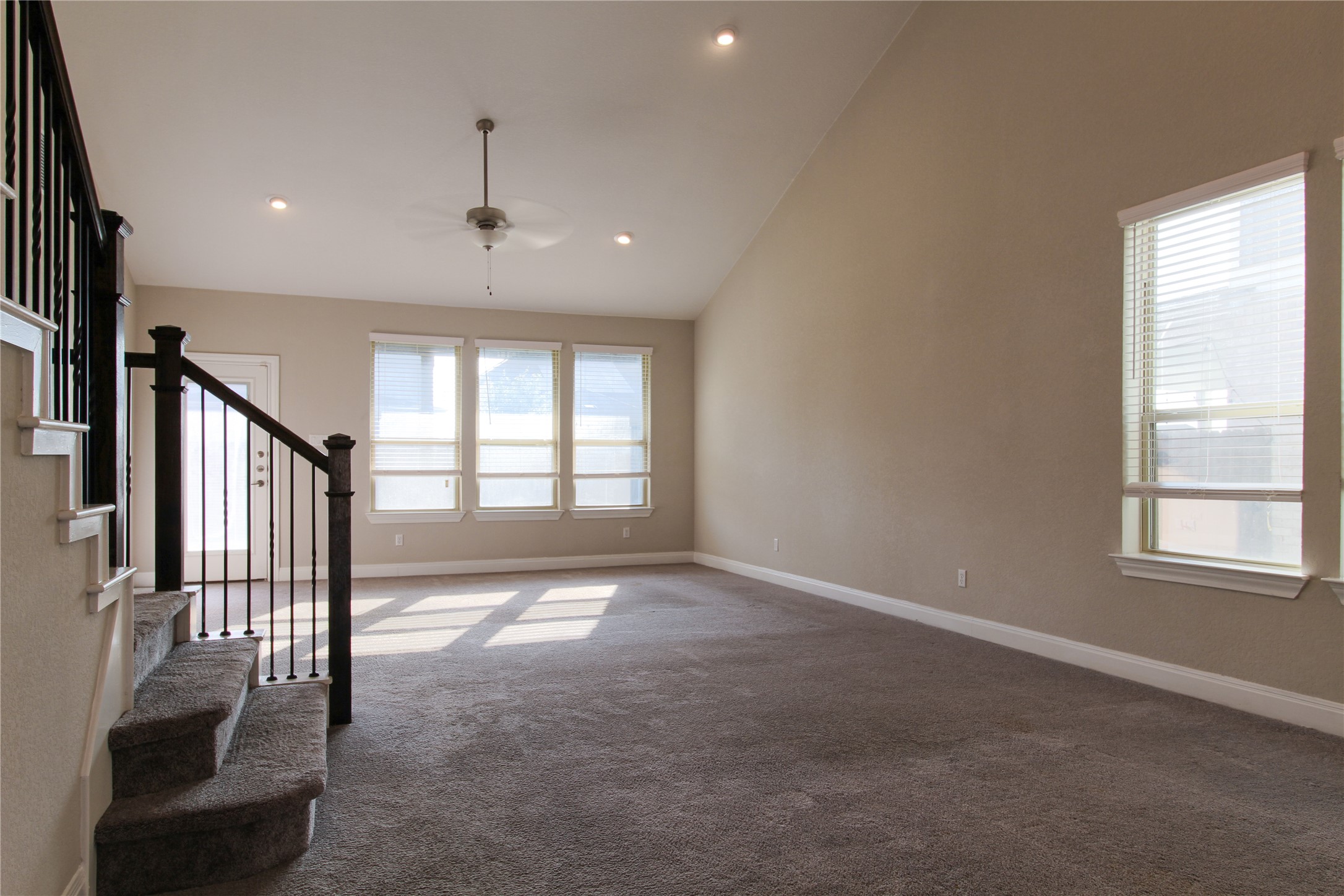 109 Yellow Thistle Cove Georgetown, TX 78626 - Photo 8 of 36 Expansive living area featuring a vaulted ceiling and recessed lighting
