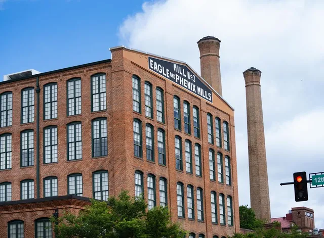 a kitchen with stainless steel appliances granite countertop a stove and cabinets