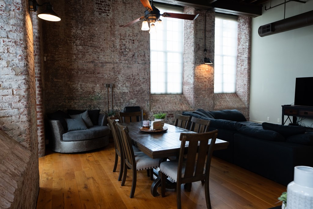 1201 Front Avenue, Unit 203 Columbus, GA 31901 - Photo 15 of 54 a view of a dining room with furniture and window