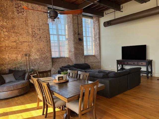 1201 Front Avenue, Unit 203 Columbus, GA 31901 - Photo 16 of 54 a living room with furniture and a flat screen tv