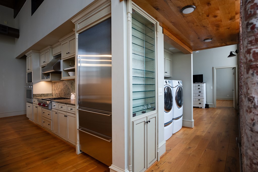 1201 Front Avenue, Unit 203 Columbus, GA 31901 - Photo 19 of 54 a kitchen with stainless steel appliances a refrigerator and a stove