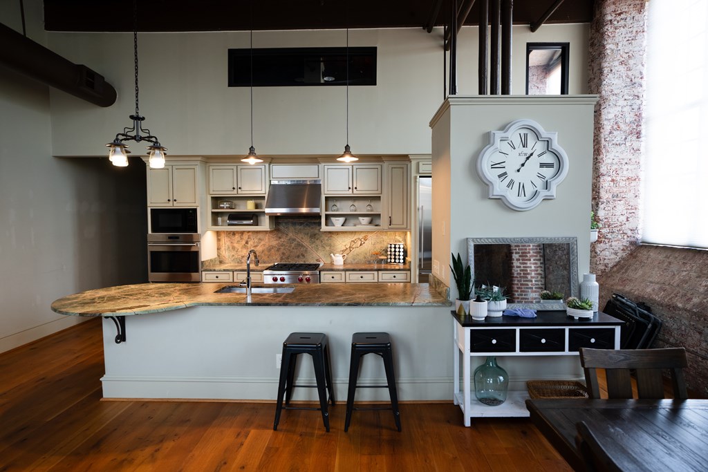 1201 Front Avenue, Unit 203 Columbus, GA 31901 - Photo 2 of 54 a kitchen with stainless steel appliances granite countertop a stove and cabinets