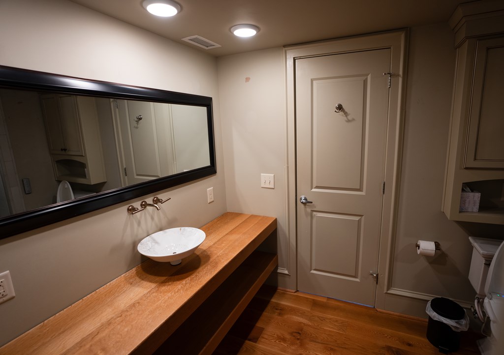 1201 Front Avenue, Unit 203 Columbus, GA 31901 - Photo 24 of 54 a bathroom with a sink and a mirror