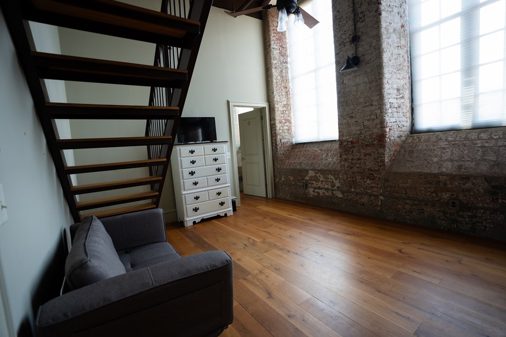 1201 Front Avenue, Unit 203 Columbus, GA 31901 - Photo 26 of 54 a living room with furniture and a fireplace