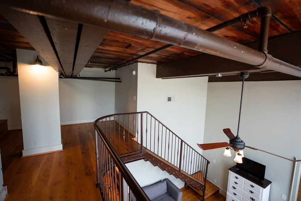 1201 Front Avenue, Unit 203 Columbus, GA 31901 - Photo 29 of 54 a view of staircase with wooden floor