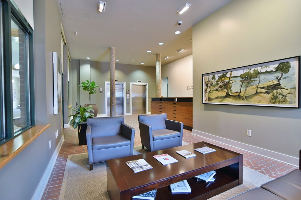 1201 Front Avenue, Unit 203 Columbus, GA 31901 - Photo 46 of 54 a living room with furniture and wooden floor