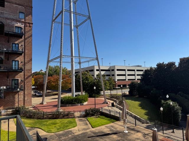 1201 Front Avenue, Unit 203 Columbus, GA 31901 - Photo 10 of 54 a view of a chairs and table in patio
