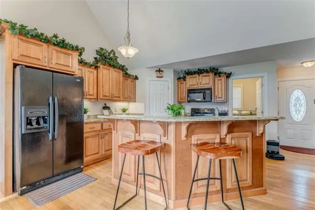 a view of a dining room with furniture and chandelier