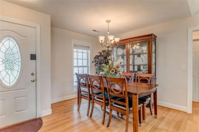a bedroom with a bed and a tv on the dresser