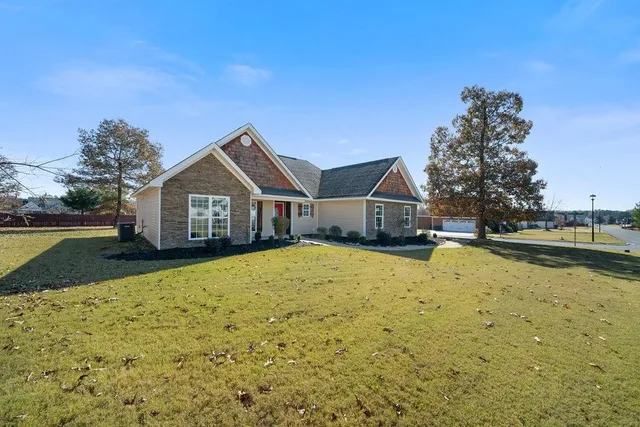 a living room with lots of furniture and a chandelier