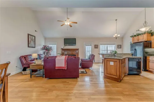a kitchen with granite countertop a table chairs stove and granite counter tops