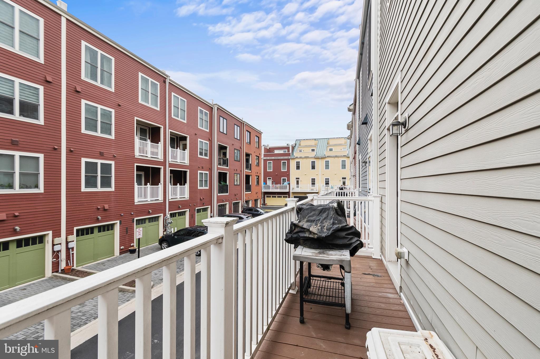 1417 Van Valkenburgh Lane Alexandria, VA 22301 - Photo 21 of 45 a view of a balcony with chairs and wooden fence