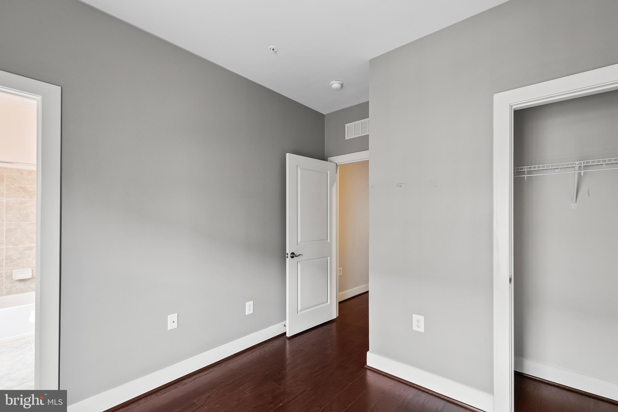 1417 Van Valkenburgh Lane Alexandria, VA 22301 - Photo 23 of 45 an empty room with wooden floor and windows