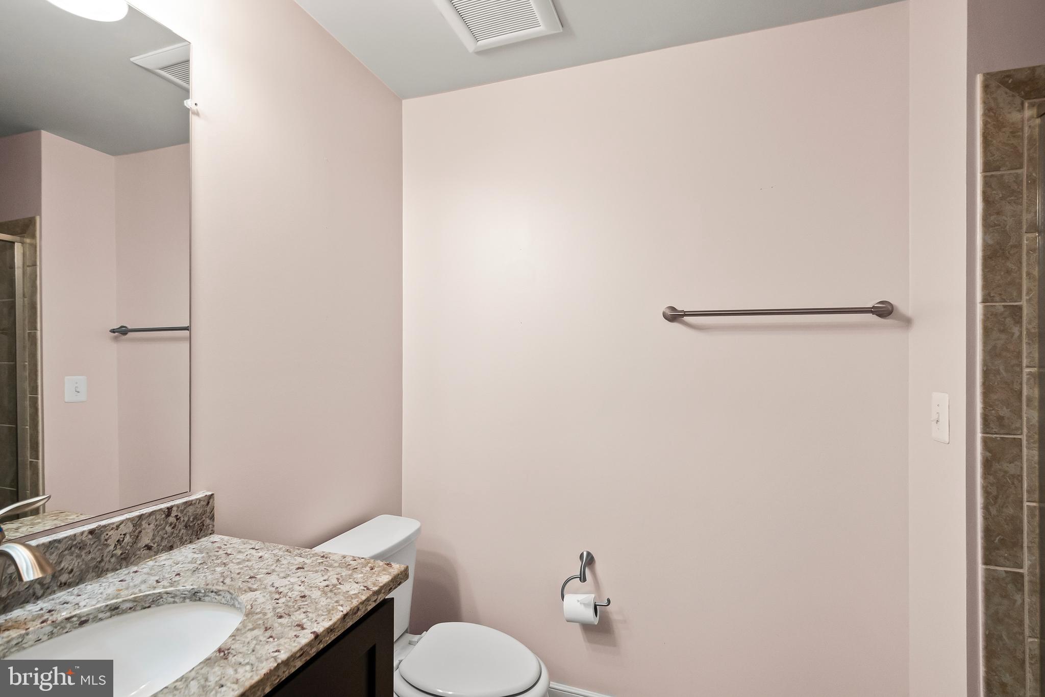 1417 Van Valkenburgh Lane Alexandria, VA 22301 - Photo 6 of 45 a bathroom with a granite countertop sink and a mirror