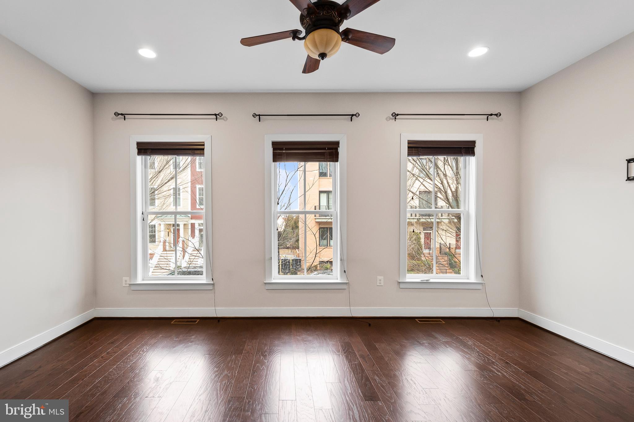 1417 Van Valkenburgh Lane Alexandria, VA 22301 - Photo 7 of 45 a view of an empty room with wooden floor and a window