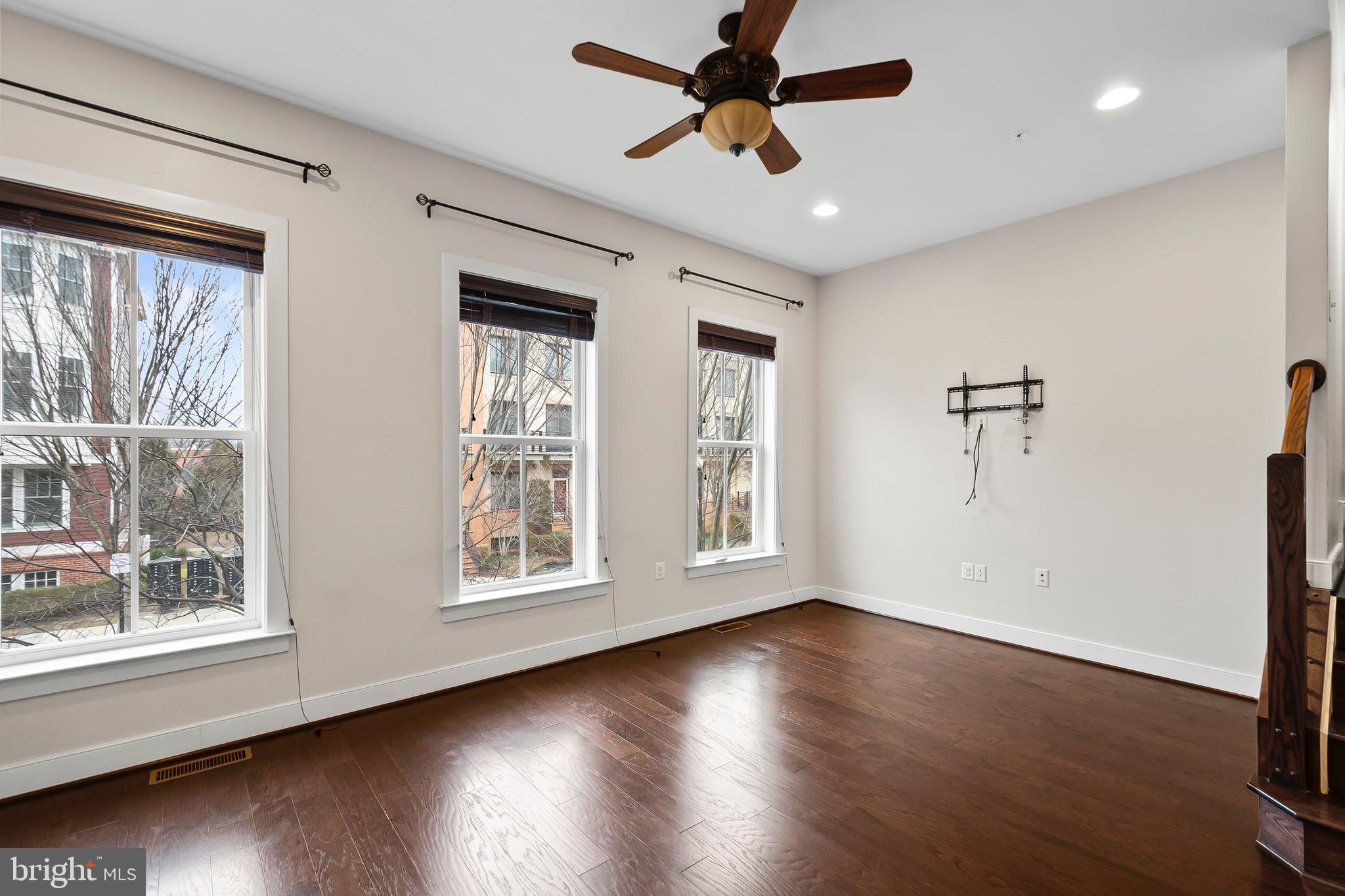1417 Van Valkenburgh Lane Alexandria, VA 22301 - Photo 8 of 45 a view of an empty room with wooden floor and a window