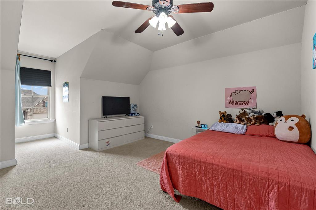 946 Maize Street Bossier City, LA 71111 - Photo 34 of 39 a bedroom with a bed and ceiling fan