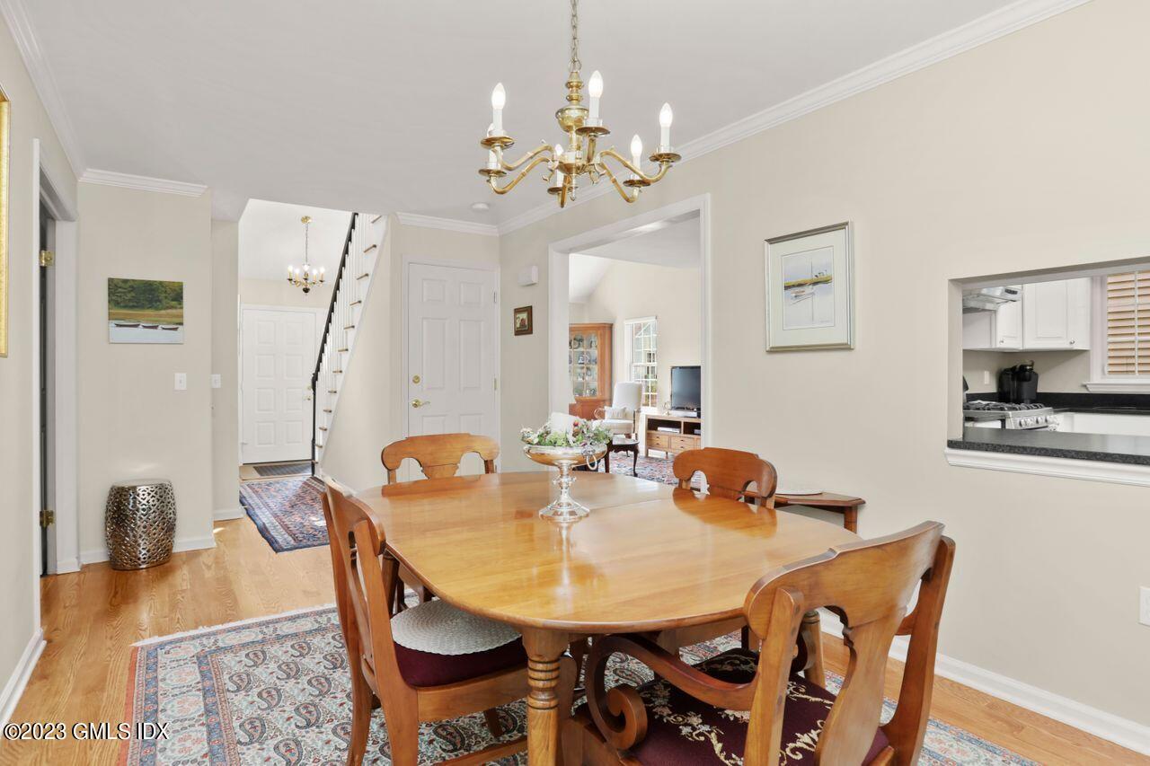 1 Shore Road, Unit 3 Stamford, CT 06902 - Photo 12 of 37 a view of a dining room with furniture and wooden floor