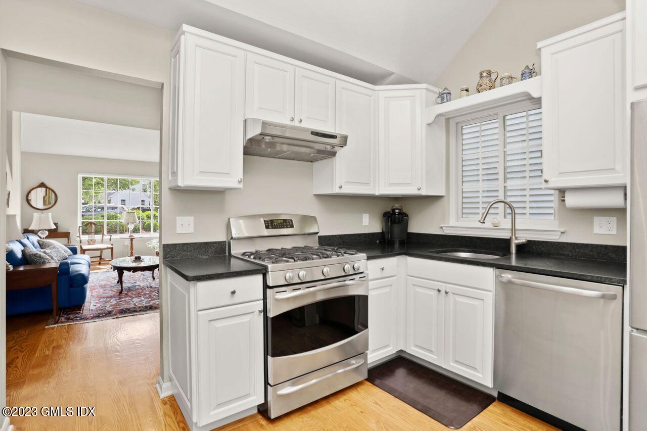 1 Shore Road, Unit 3 Stamford, CT 06902 - Photo 13 of 37 a kitchen with stainless steel appliances granite countertop a stove sink and cabinets