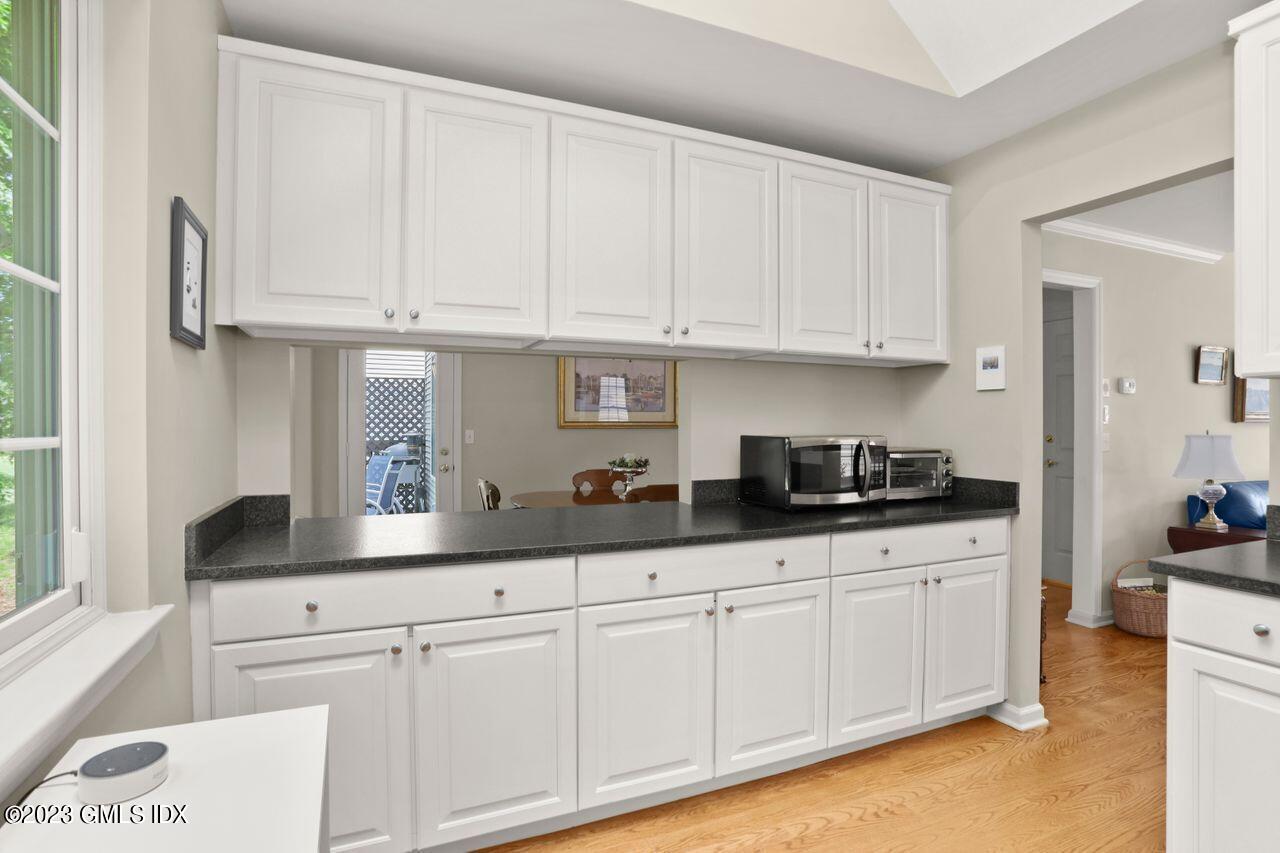1 Shore Road, Unit 3 Stamford, CT 06902 - Photo 15 of 37 a kitchen with white cabinets and sink