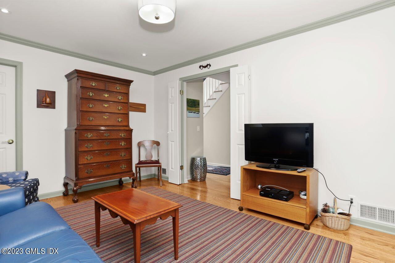 1 Shore Road, Unit 3 Stamford, CT 06902 - Photo 19 of 37 a living room with furniture and a flat screen tv