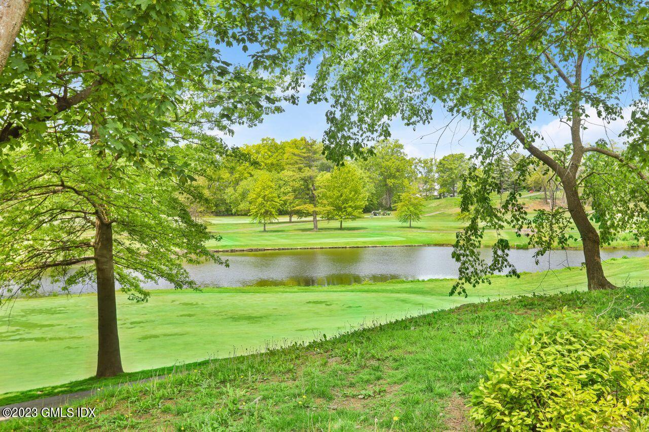1 Shore Road, Unit 3 Stamford, CT 06902 - Photo 2 of 37 a view of lake from a yard
