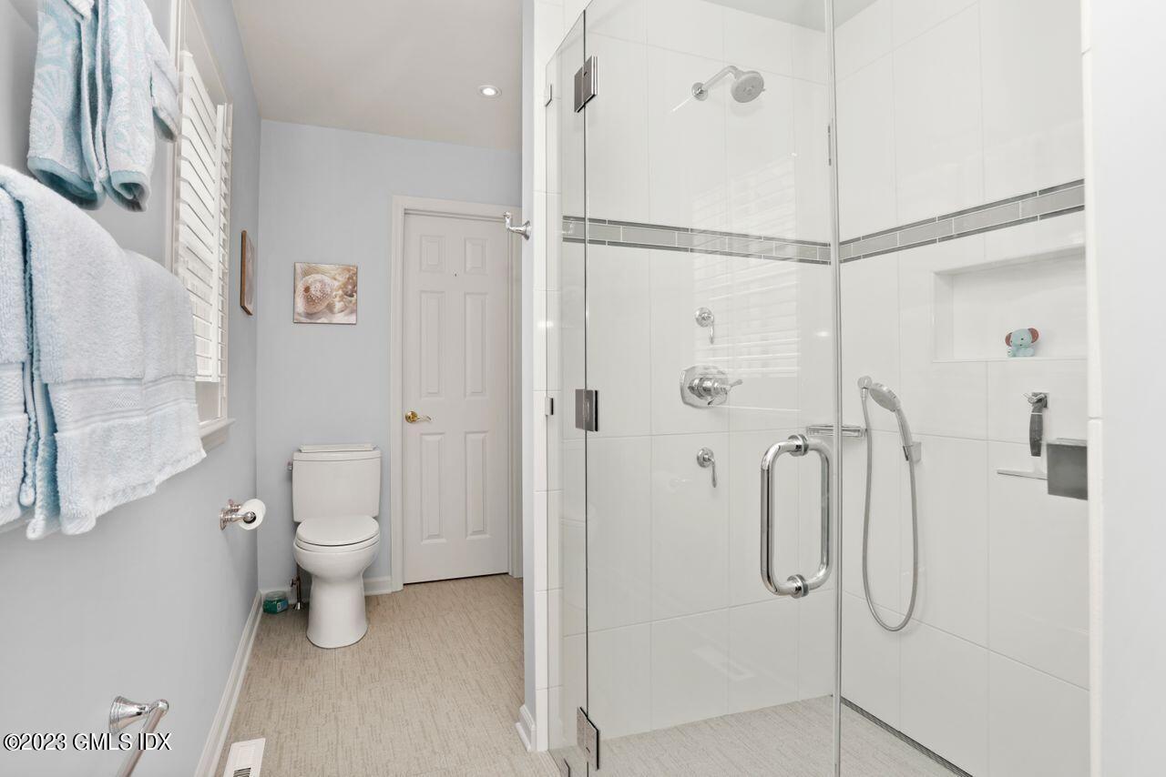 1 Shore Road, Unit 3 Stamford, CT 06902 - Photo 21 of 37 a bathroom with a shower toilet and sink
