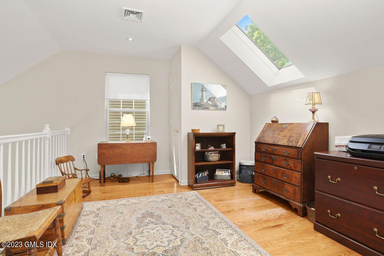 1 Shore Road, Unit 3 Stamford, CT 06902 - Photo 22 of 37 a bedroom with furniture and a dresser