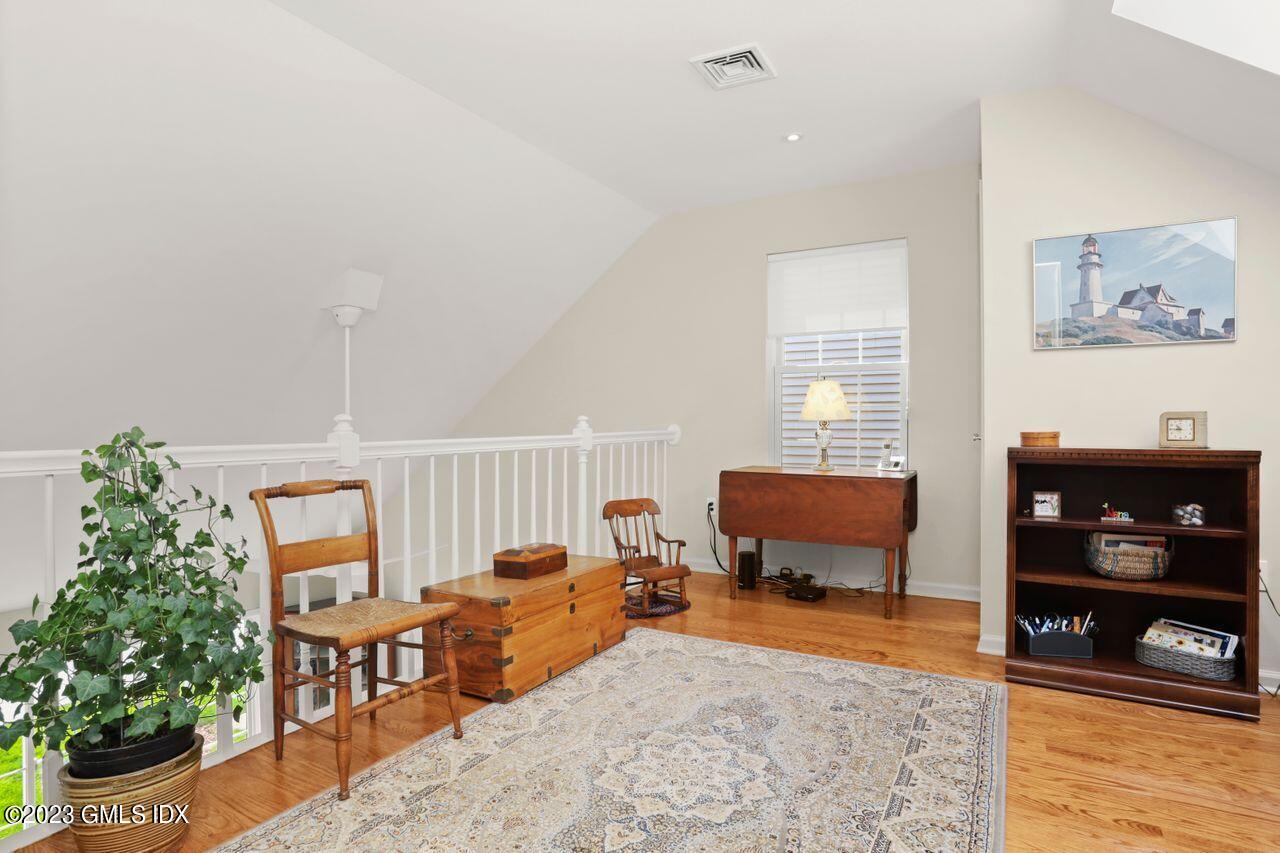 1 Shore Road, Unit 3 Stamford, CT 06902 - Photo 23 of 37 a living room with furniture and a flat screen tv