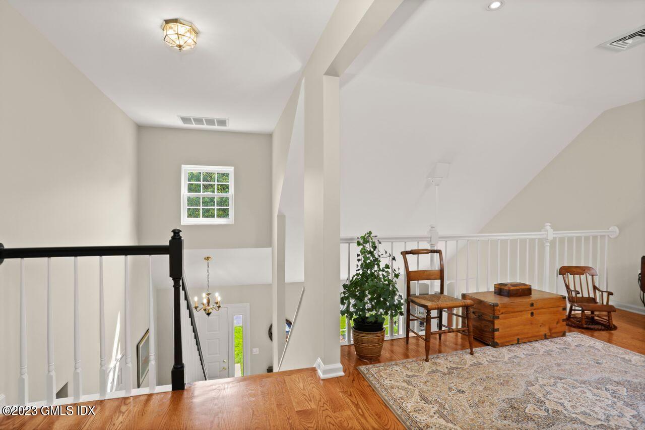 1 Shore Road, Unit 3 Stamford, CT 06902 - Photo 24 of 37 a living room with furniture and a wooden floor