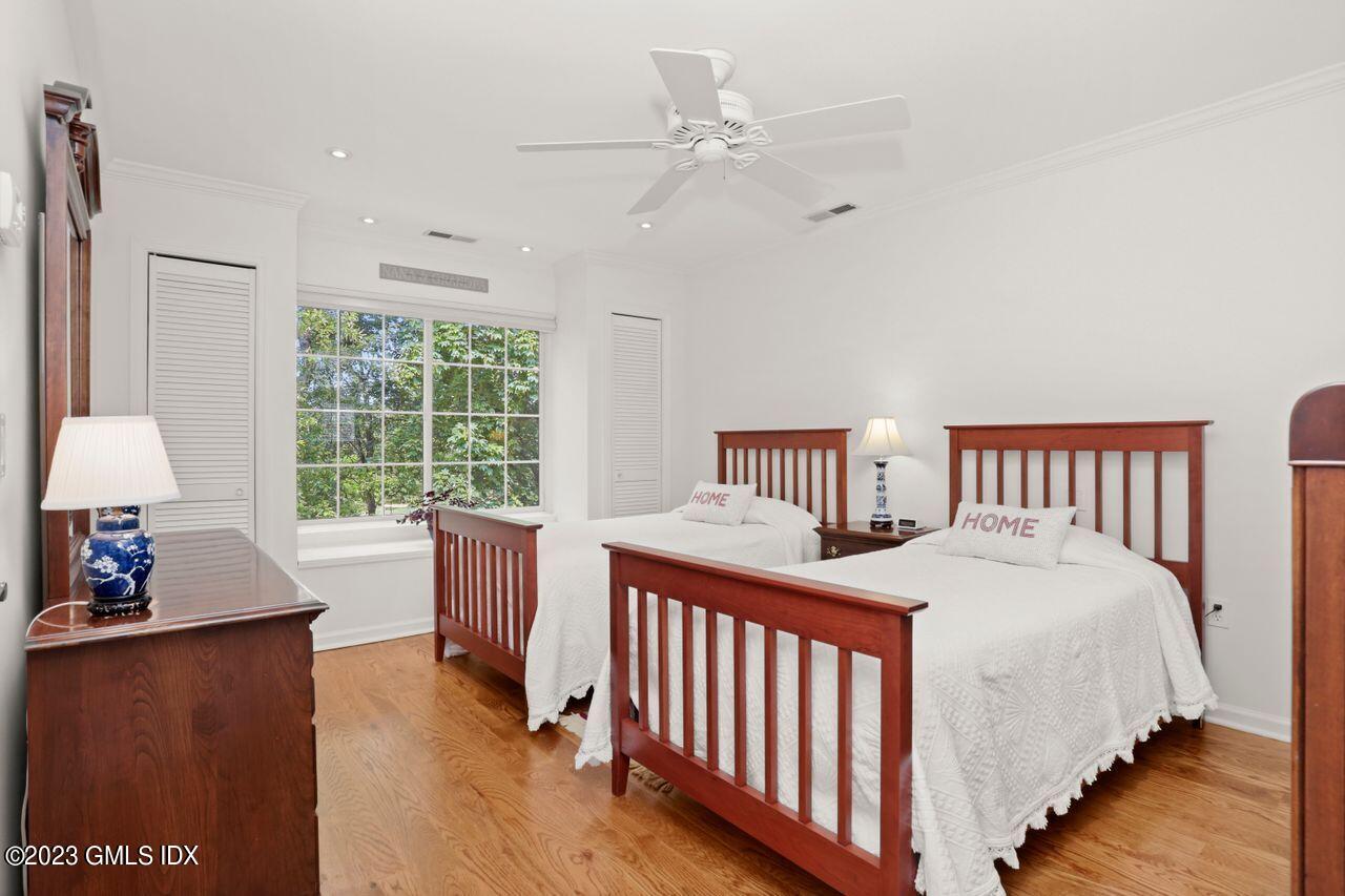 1 Shore Road, Unit 3 Stamford, CT 06902 - Photo 26 of 37 a bedroom with a bed and a table in it