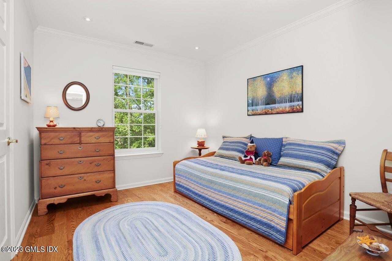 1 Shore Road, Unit 3 Stamford, CT 06902 - Photo 28 of 37 a bedroom with a bed and a dresser