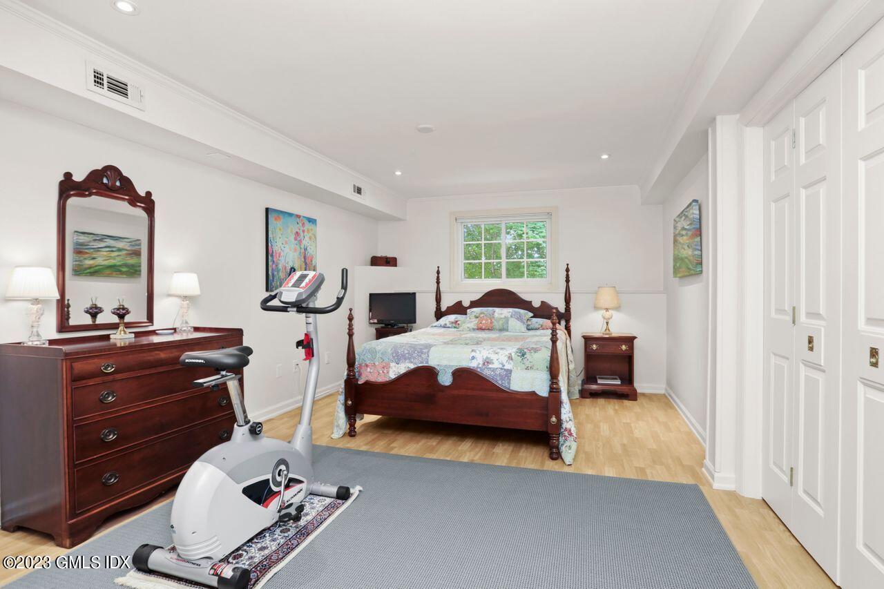1 Shore Road, Unit 3 Stamford, CT 06902 - Photo 29 of 37 a bedroom with a bed and large windows