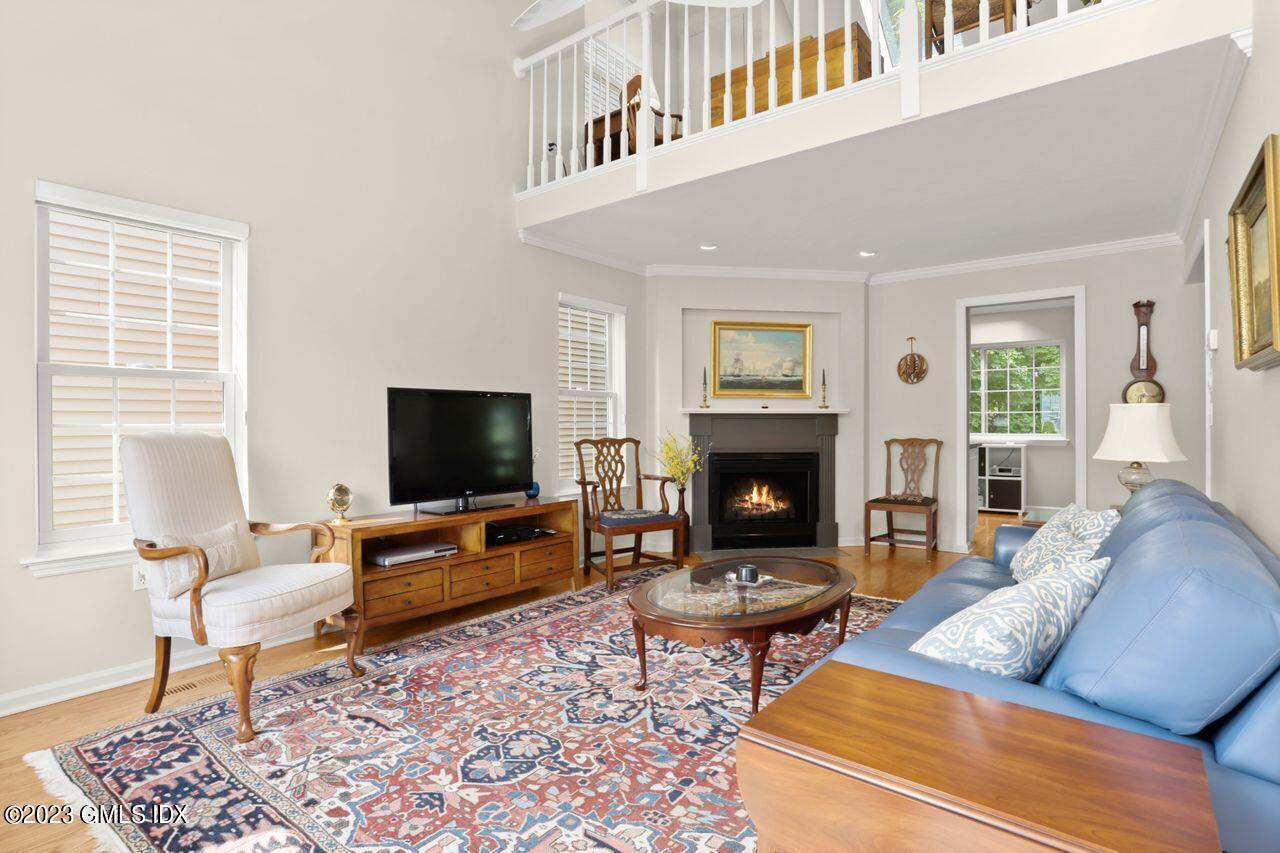 1 Shore Road, Unit 3 Stamford, CT 06902 - Photo 5 of 37 a living room with furniture and a flat screen tv