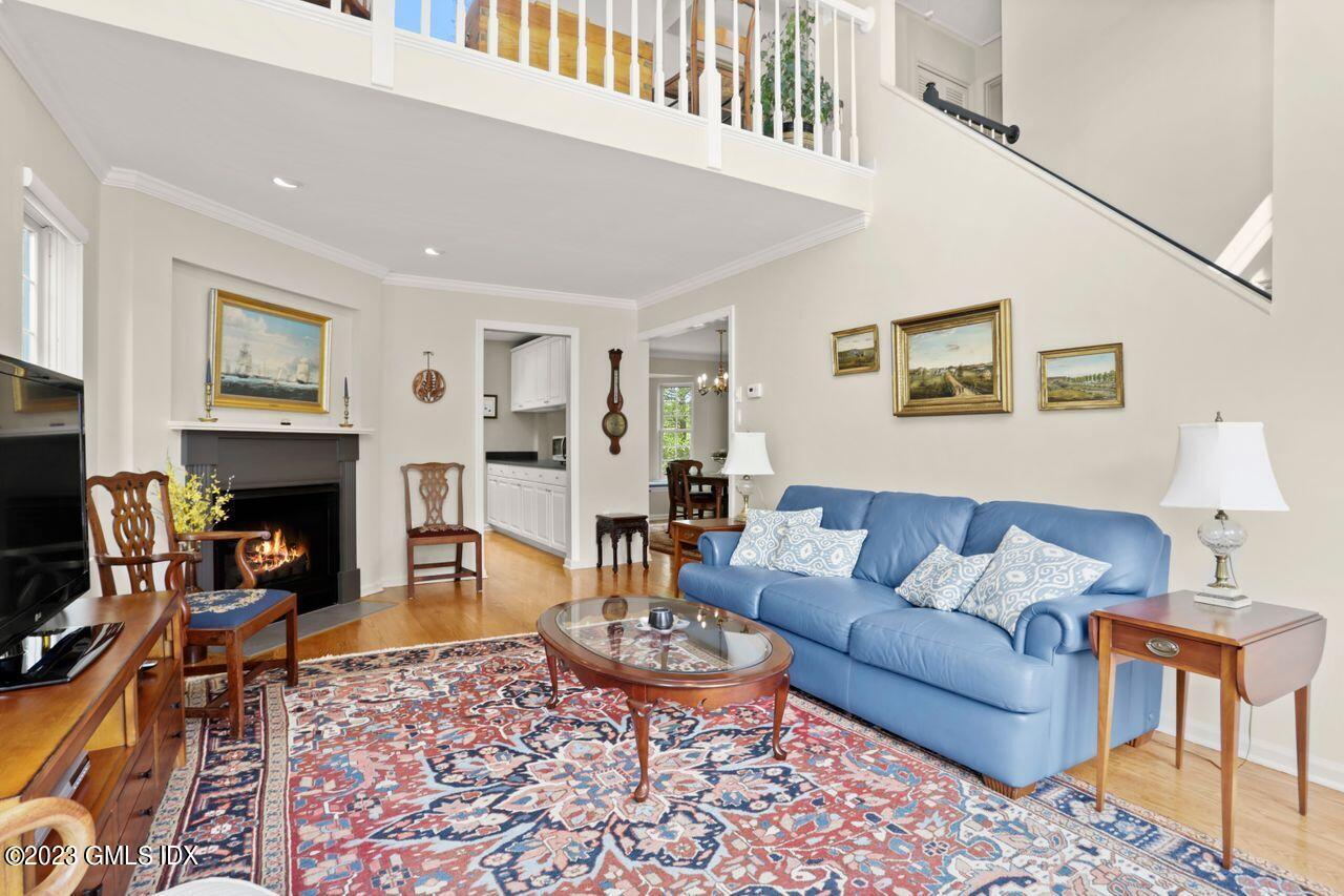 1 Shore Road, Unit 3 Stamford, CT 06902 - Photo 6 of 37 a living room with furniture and a fireplace