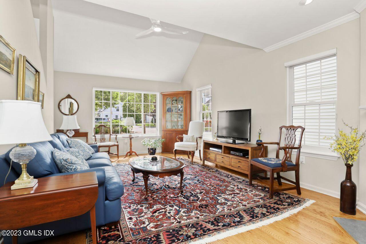 1 Shore Road, Unit 3 Stamford, CT 06902 - Photo 7 of 37 a living room with furniture and a flat screen tv