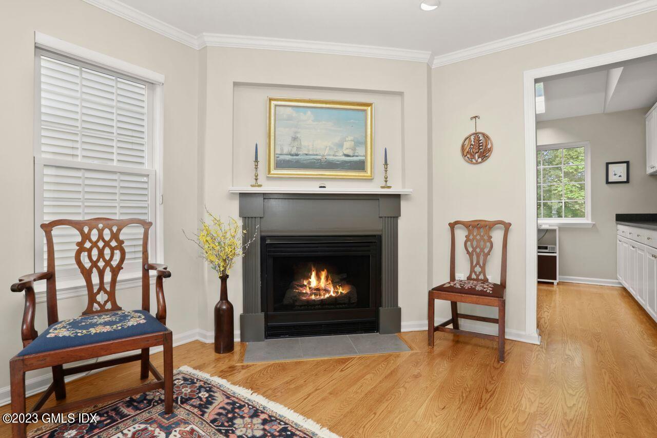 1 Shore Road, Unit 3 Stamford, CT 06902 - Photo 9 of 37 a living room with furniture and a fireplace