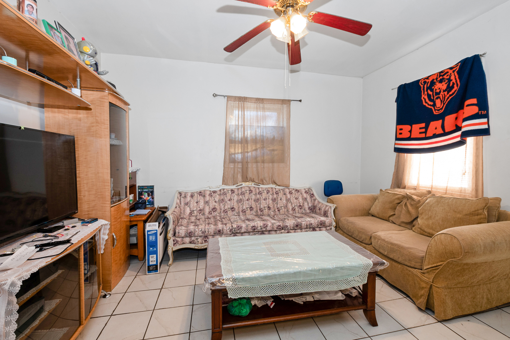 2857 South Kostner Avenue Chicago, IL 60623 - Photo 17 of 21 a bedroom with furniture and a flat screen tv