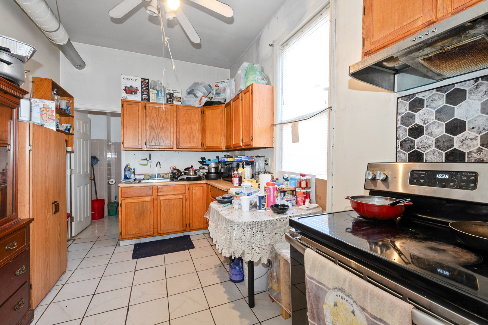 2857 South Kostner Avenue Chicago, IL 60623 - Photo 18 of 21 a kitchen with stainless steel appliances granite countertop a stove and a refrigerator