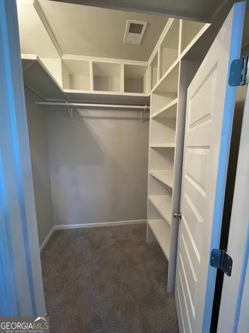 a view of an empty walk in closet
