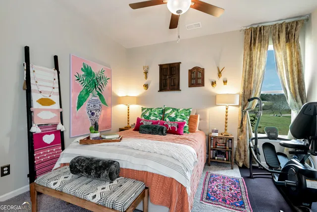 a bedroom with bed and a window